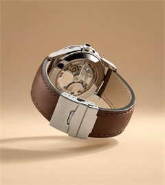Sample piece: a chronograph watch with a brown leather strap.